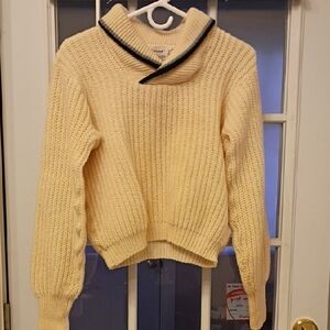 Chic Cream Turtleneck Sweater with Black Trim